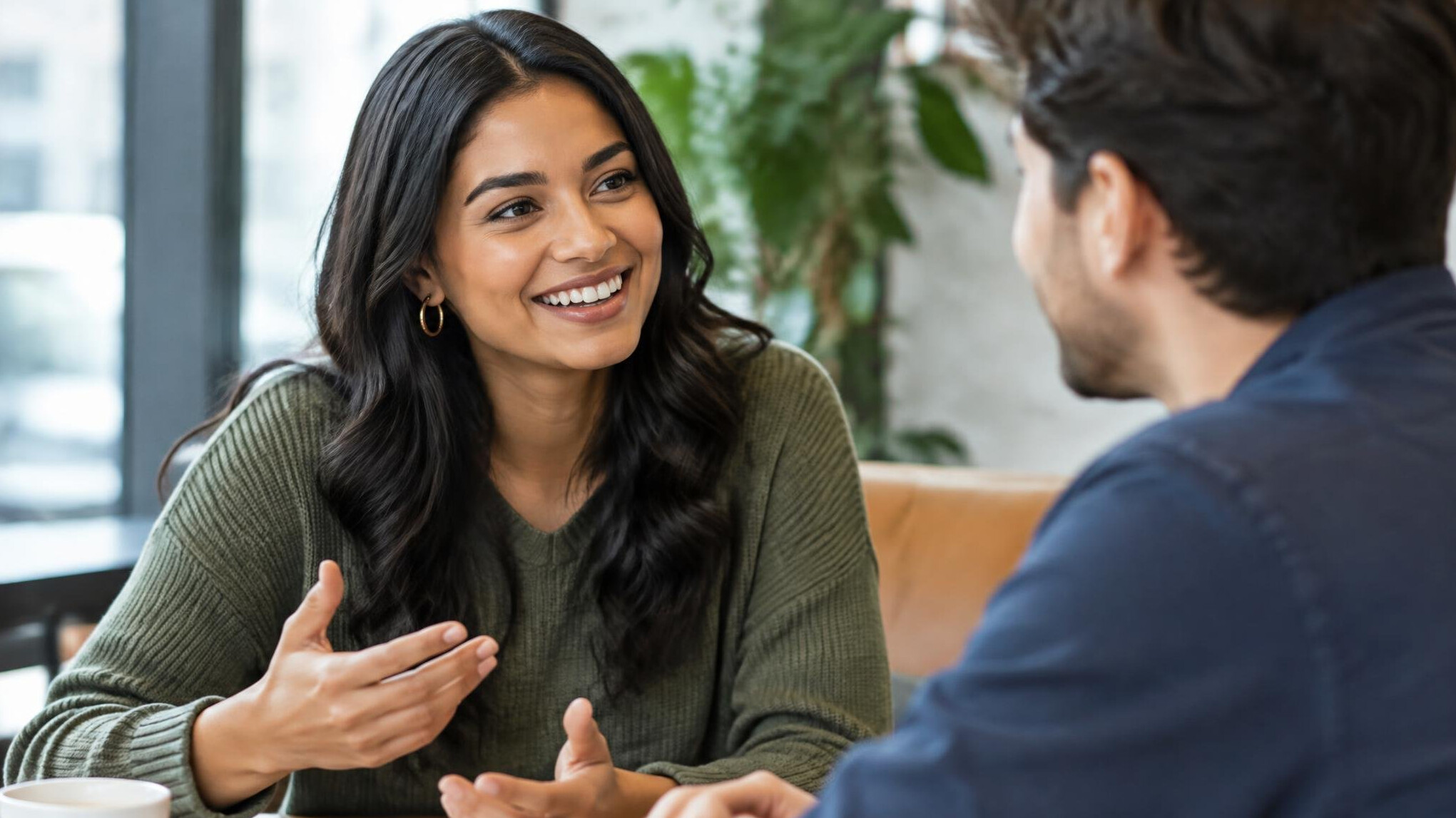 person smiling during conversation