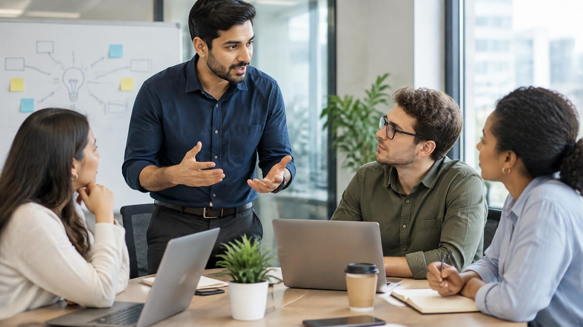 man explaining idea to colleagues